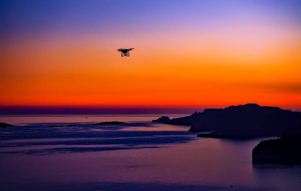 Drone flying in the sunset