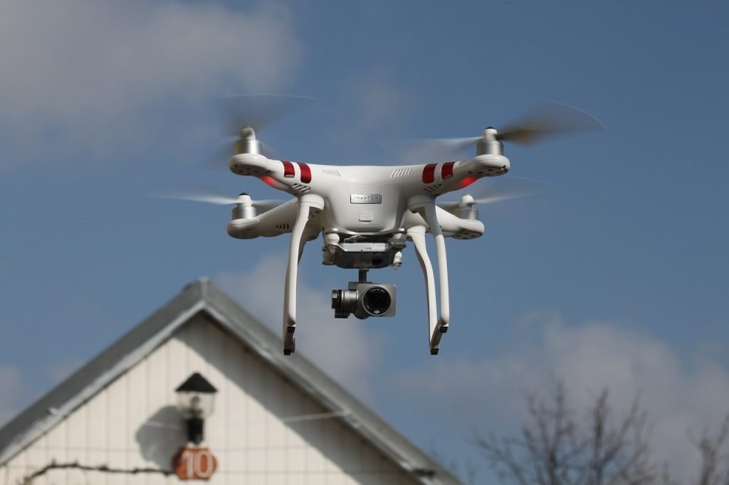 Drone hovering in front of residential house