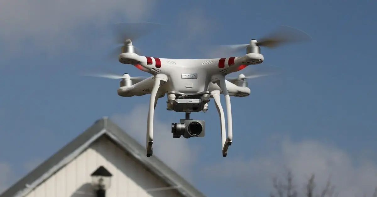 Drone hovering in front of residential house