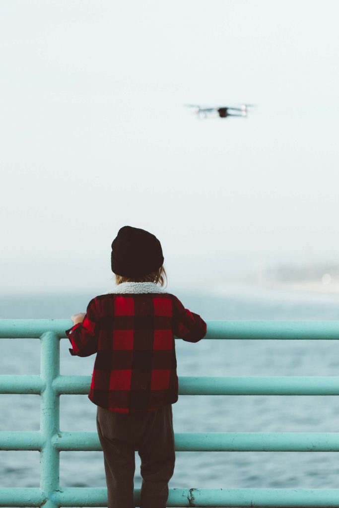 Drone flying by a child